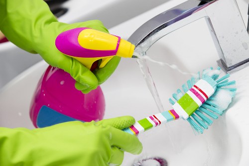 Technician treating stains on a mattress in a local Islington flat